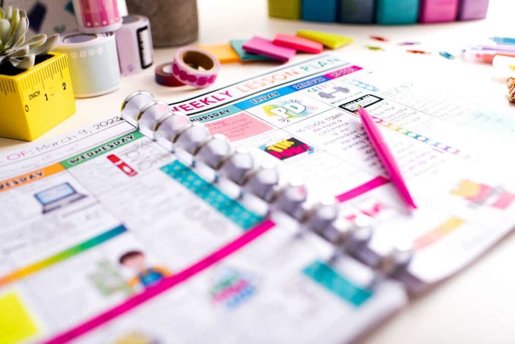 5 Ways To Make Lesson Planning Fun; Planner laying on teacher desk